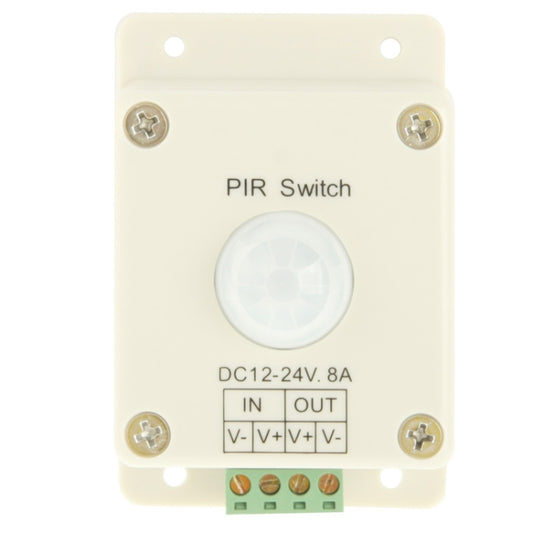 Off-white PIR switch controller front view with sensor lens and IN/OUT terminal markings