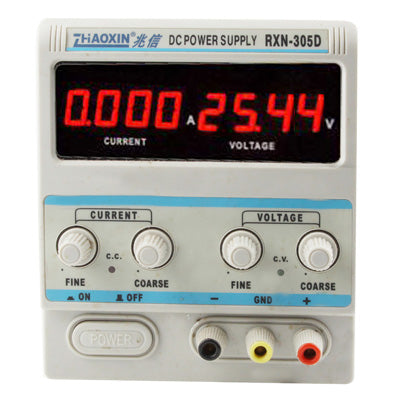 Adjustable DC power supply front panel with red voltage/current meters and knob controls, white