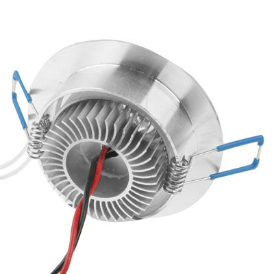 Stainless backplate of a 3-LED downlight with heat-sink fins and red/black wires