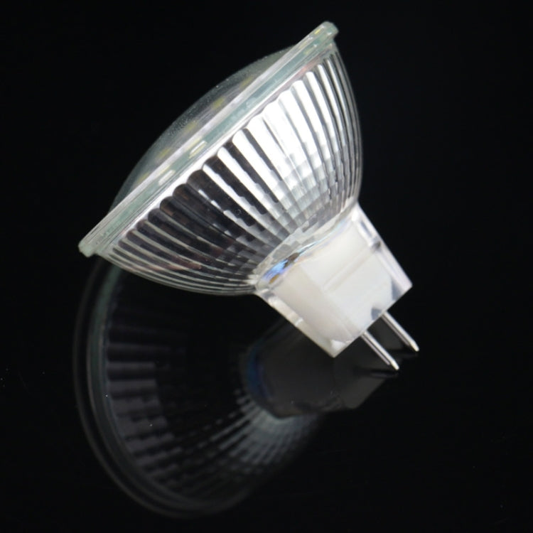 Bi-pin LED bulb with clear ribbed lens and visible LED chip array