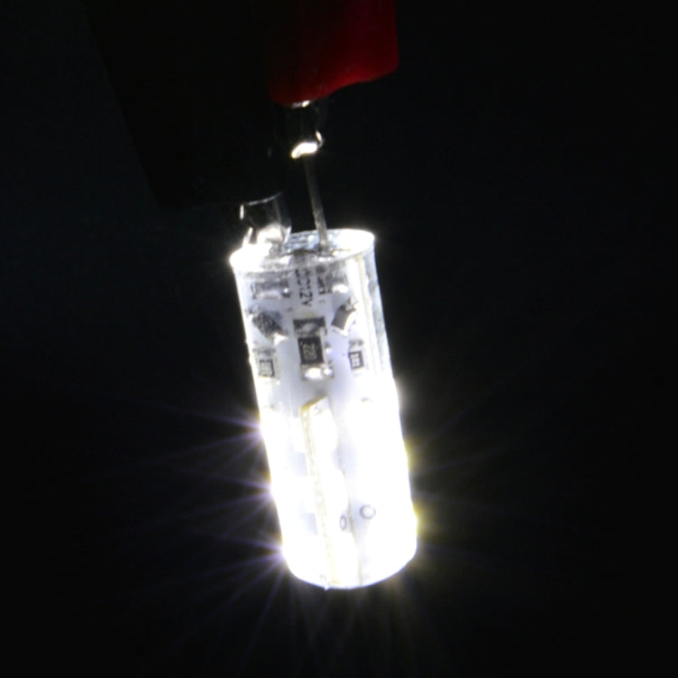 Lit SMD LED module with two metal pins in clear casing, bright white light