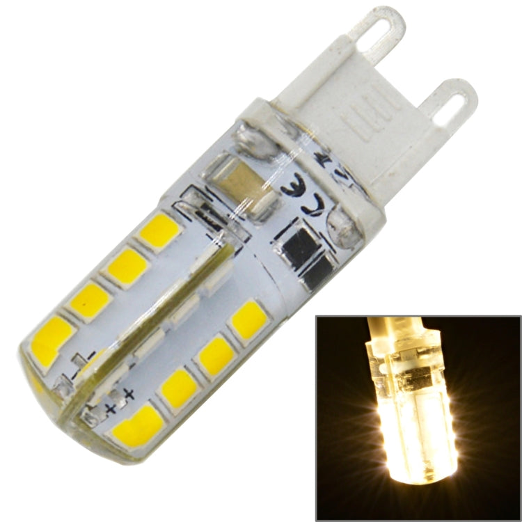 Clear two-pin SMD LED bulb with yellow LEDs; inset shows warm light glow