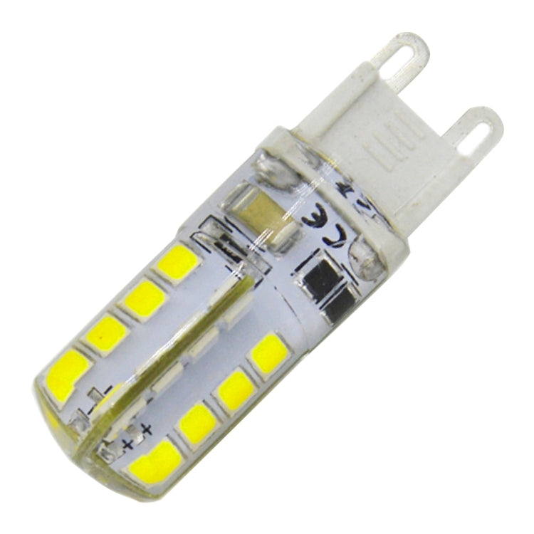 Clear two-pin SMD LED bulb, angled view of yellow LED chip strip on the capsule