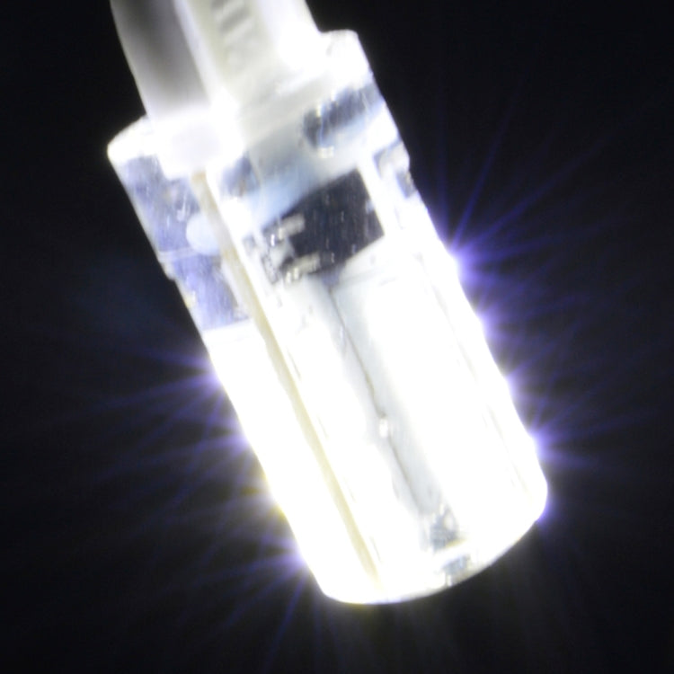 Lit clear two-pin SMD LED bulb emitting bright white light