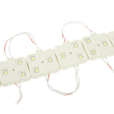 3-LED SMD LED light strip modules with red/white wires and white LED chips, close-up