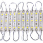 Warm white LED strip modules, straight view with gray leads and white circuit panels