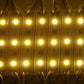 Warm white LED modules glowing in a row, showing multiple bright light points