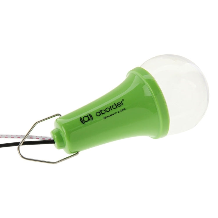 Solar-powered LED bulb with green body and metal hanging loop