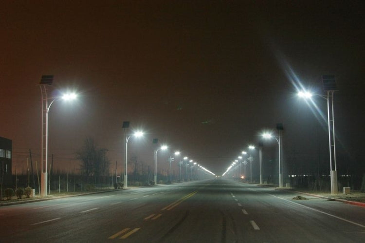 Solar-powered street lights on tall poles with bright LEDs