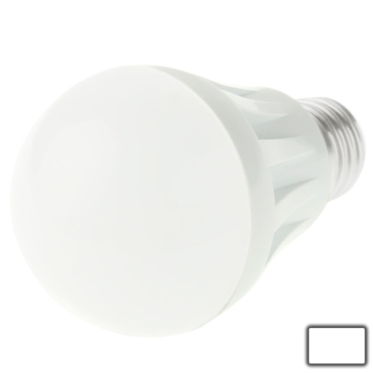 White LED bulb with rounded cover and screw base, close-up from side