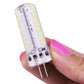 G4 LED light bulb held in hand, clear body with SMD LED row and two-pin base