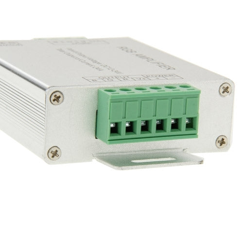 RGB amplifier close-up showing green multi-pin output terminal block on metal housing