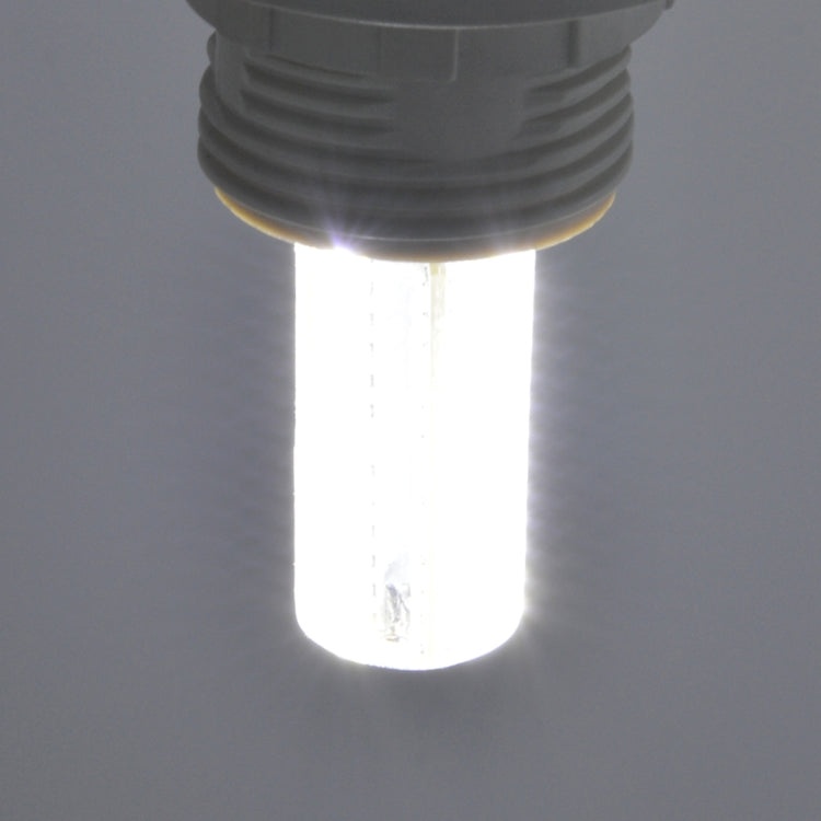 Lit E14 LED bulb emitting bright warm white light from clear housing