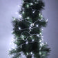 Green artificial Christmas tree with white LED string lights