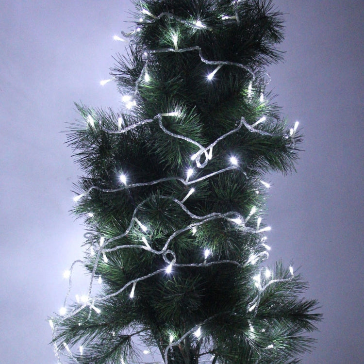 Cool white LED string lights on dark green Christmas garland