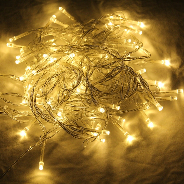 Warm white LED string lights on metallic wire, loose coil