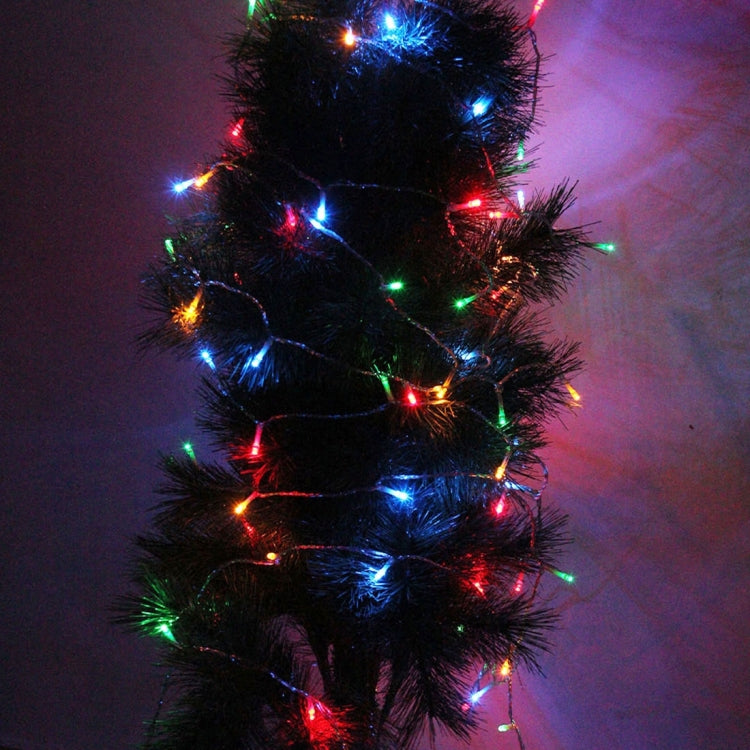 Black tinsel garland wrapped with multicolor RGB LED lights