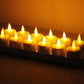 Warm LED candle lights in a row with glowing flames on a base