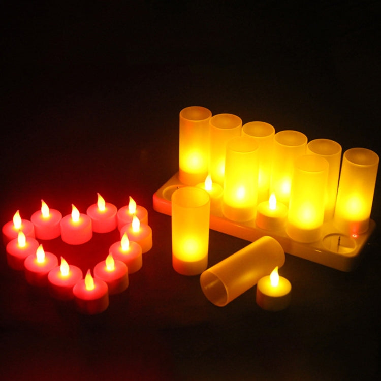 Warm LED candle lights on a charging base with several candles glowing
