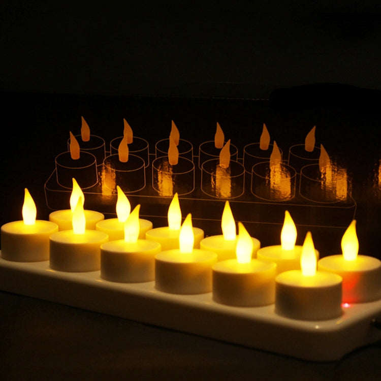 Warm LED candles with flame effect in clear cups on a tray