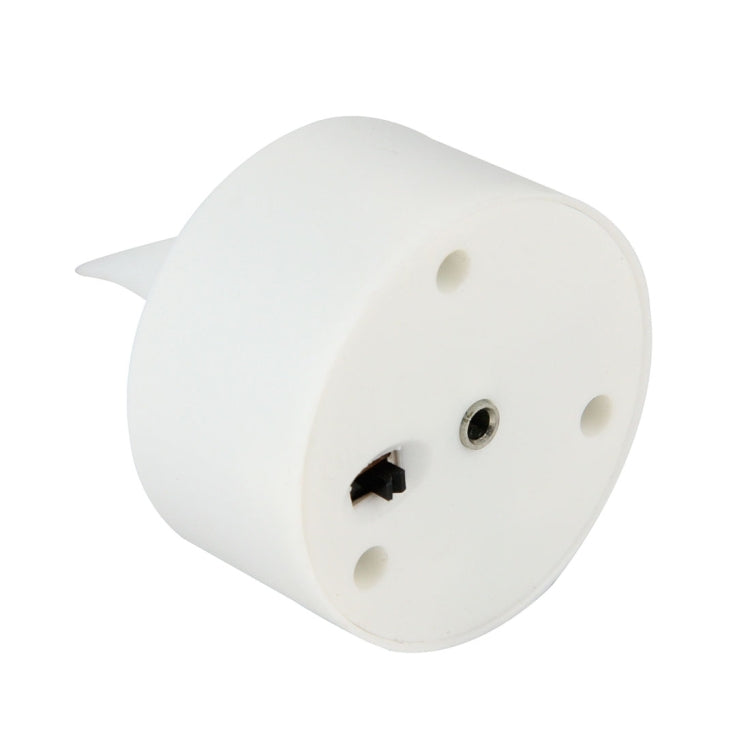 Bottom view of LED candle light showing charging contact and pin socket