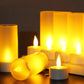 Rechargeable LED candle light set with warm glow, candles on black surface