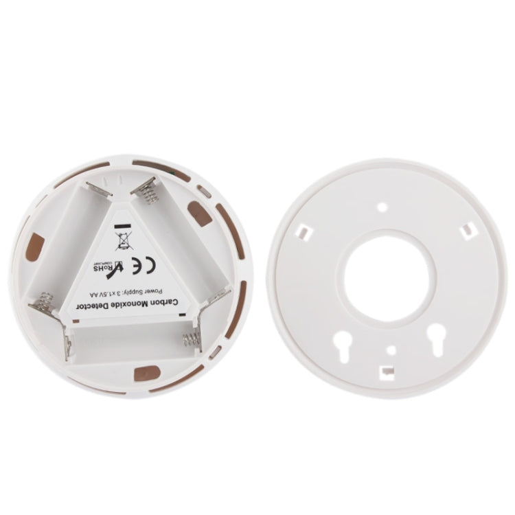 Carbon monoxide detector back cover removed with battery contacts and mounting points
