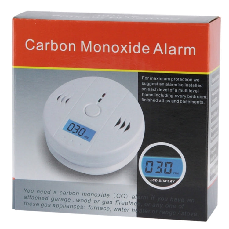 Carbon monoxide alarm packaging with white detector and LCD display shown