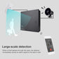 Black alarm host with control panel and nearby white motion sensor silhouette