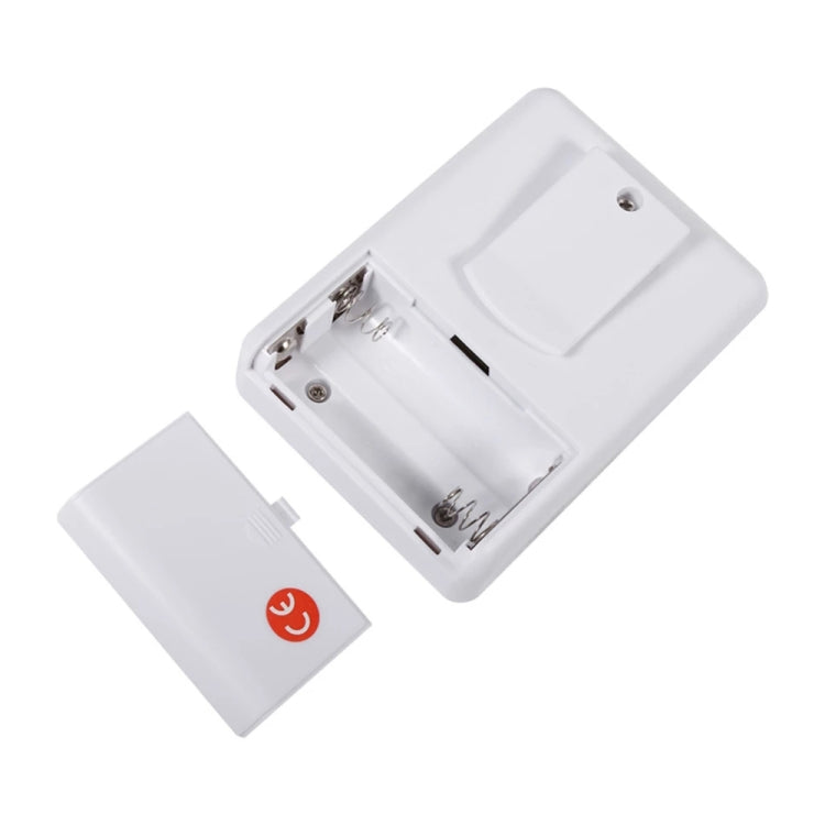 White wireless doorbell unit with open battery compartment and separate battery cover