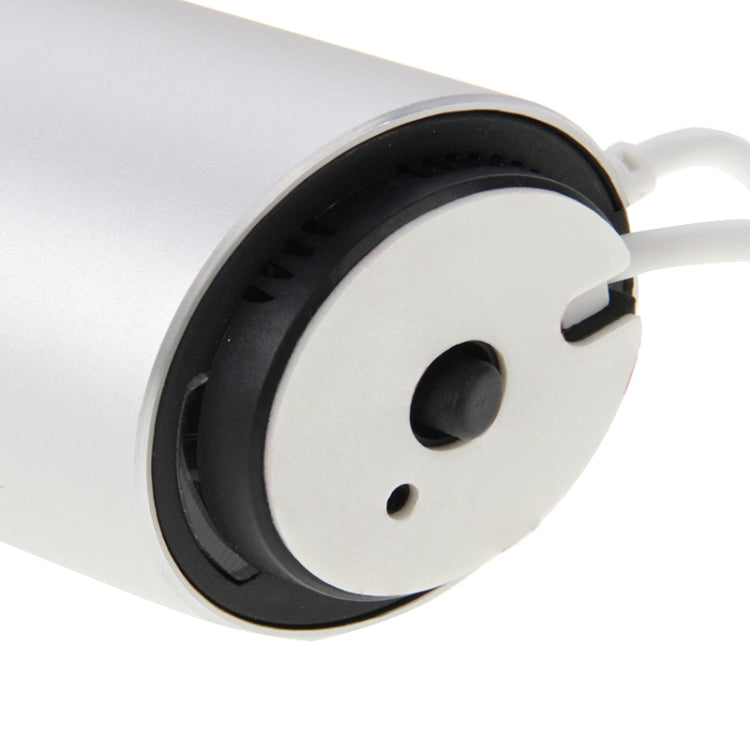 Cylindrical docking base with black speaker grille ring and side connection port