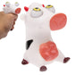 White pig eye toy figure with red ears and yellow eyes, sitting pose