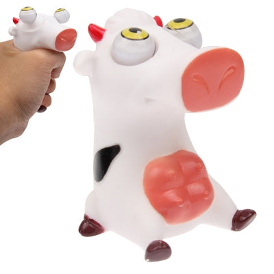 White pig eye toy figure with red ears and yellow eyes, sitting pose