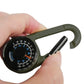 Hand holding olive carabiner key compass with thermometer dial and needle indicators