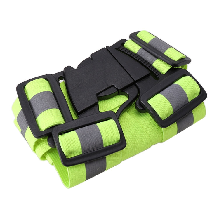 Neon green reflective safety vest, folded, with black straps and adjustable buckle