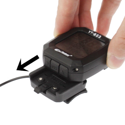 LCD bicycle speedometer back panel opened to reveal battery compartment