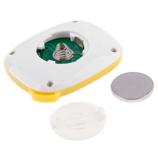 Yellow-and-white pedometer with open battery compartment and coin battery