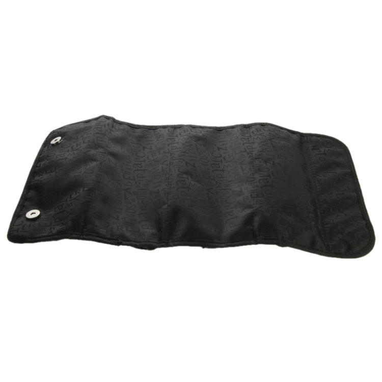 Black cosmetic organizer pouch with embossed pattern and snap strap