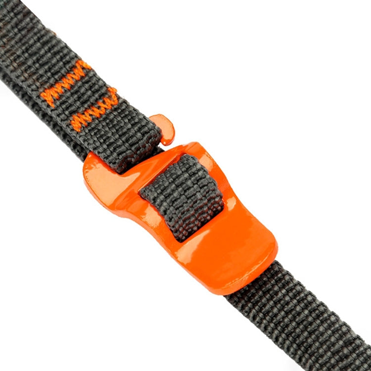 Close-up of dark gray strap with orange quick-release buckle and orange latch