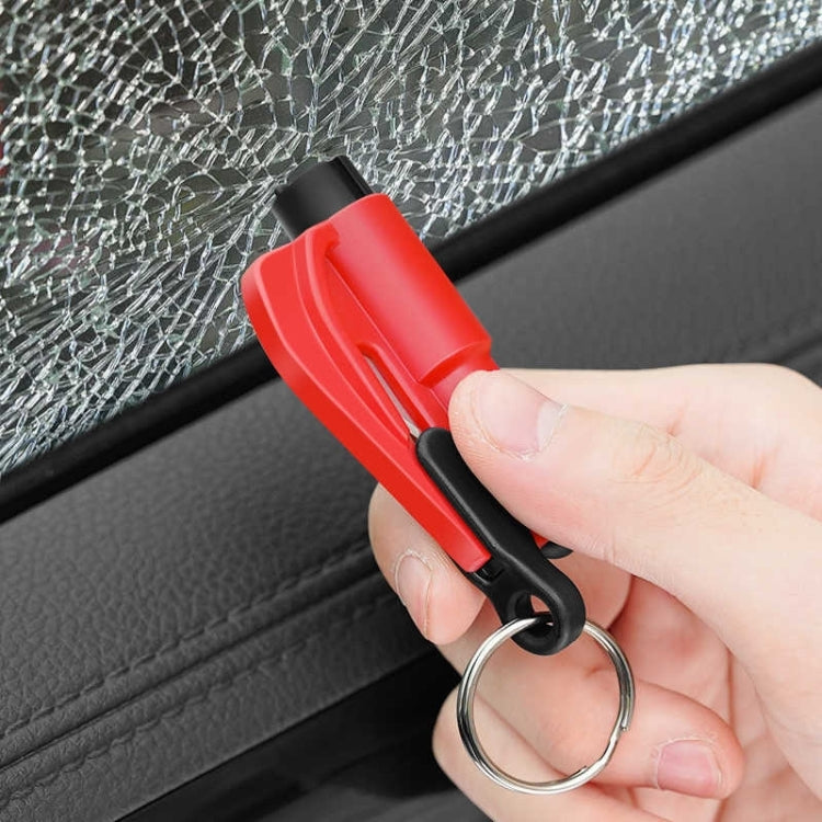 2-in-1 car emergency hammer keychain tool, red, held against shattered car glass