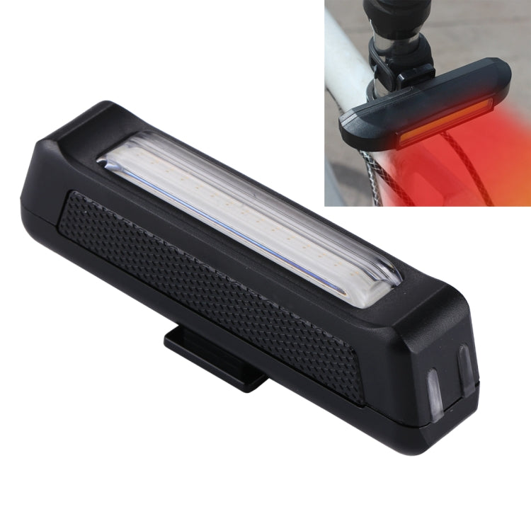 Black USB rechargeable head light with textured body and mounting clip