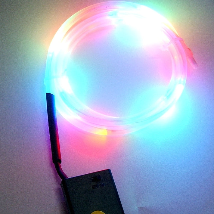 Glowing multicolor LED light ring on bicycle wheel rim with power cable