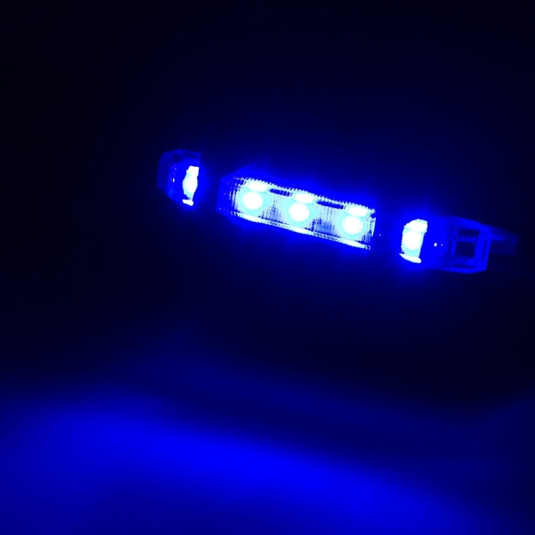 Blue LED bike taillight glowing with multiple light segments.