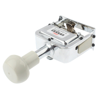 Automatic metal numbering machine with white handle and metal base, angled perspective