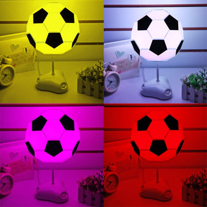 Soccer ball USB night light on stand, glowing in bright yellow and purple colors.