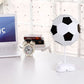 White soccer ball USB night light on desk stand with black pentagon panels.