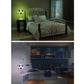 Soccer ball USB night light on stand, glowing green in a bedroom setting.