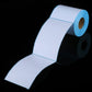 Thermal label paper strip, white labels with blue edge, rolled out for printing
