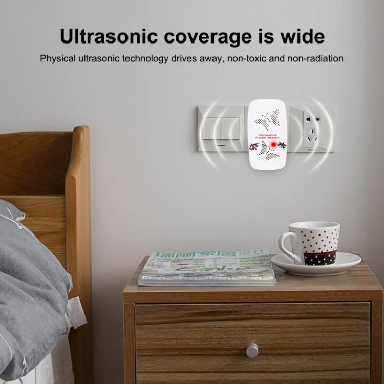 Ultrasonic pest repeller plugged in on wall, white device with wave icons