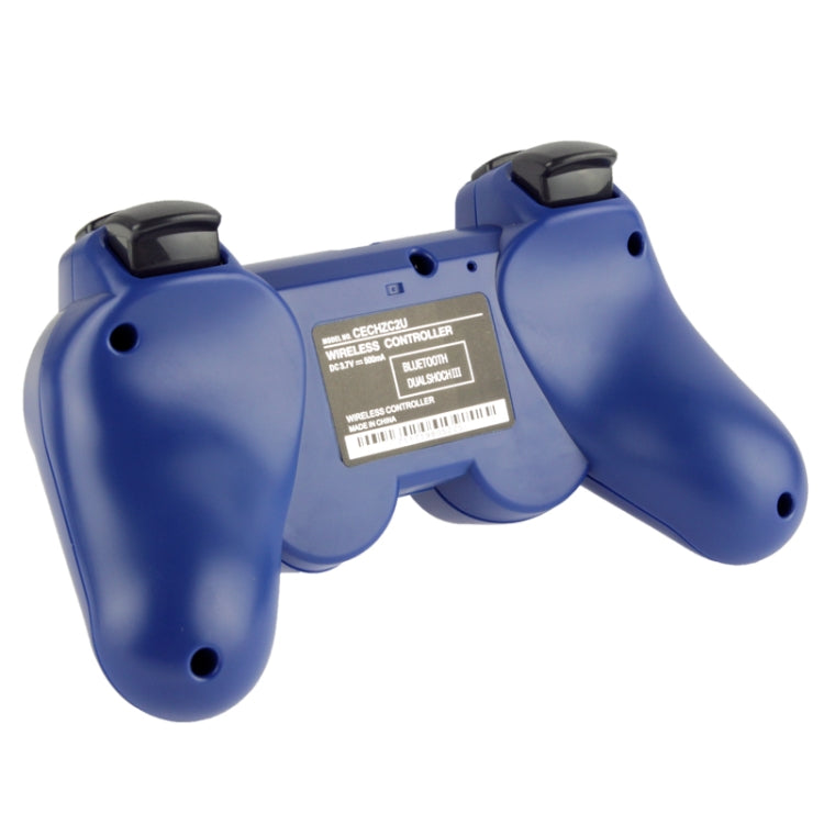Blue wireless PS3 controller rear view with barcode label and shoulder button tops